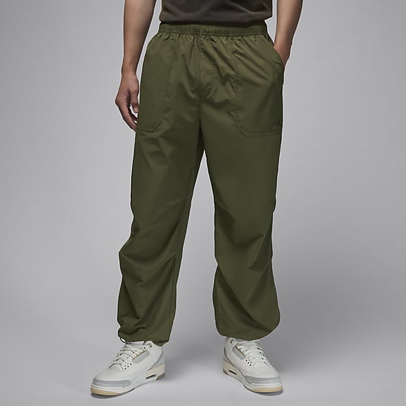 Olive green nike track pants online